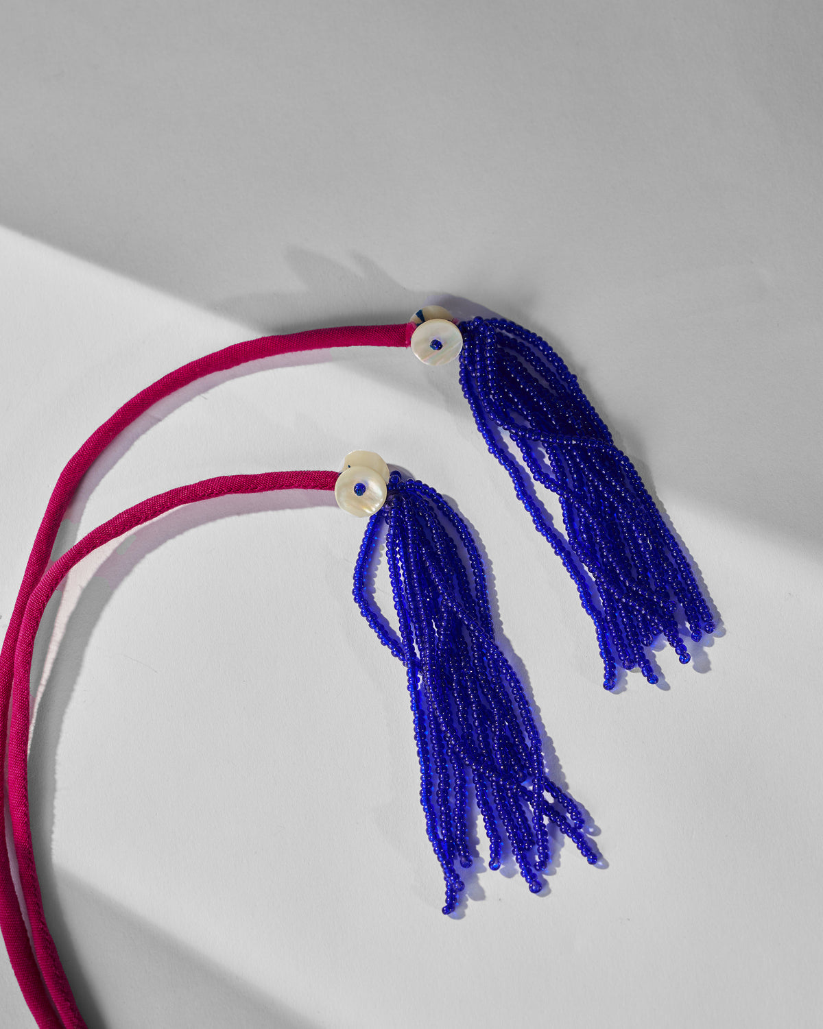 Close-up of the blue beaded tassels on the Chandphool Choker cord.