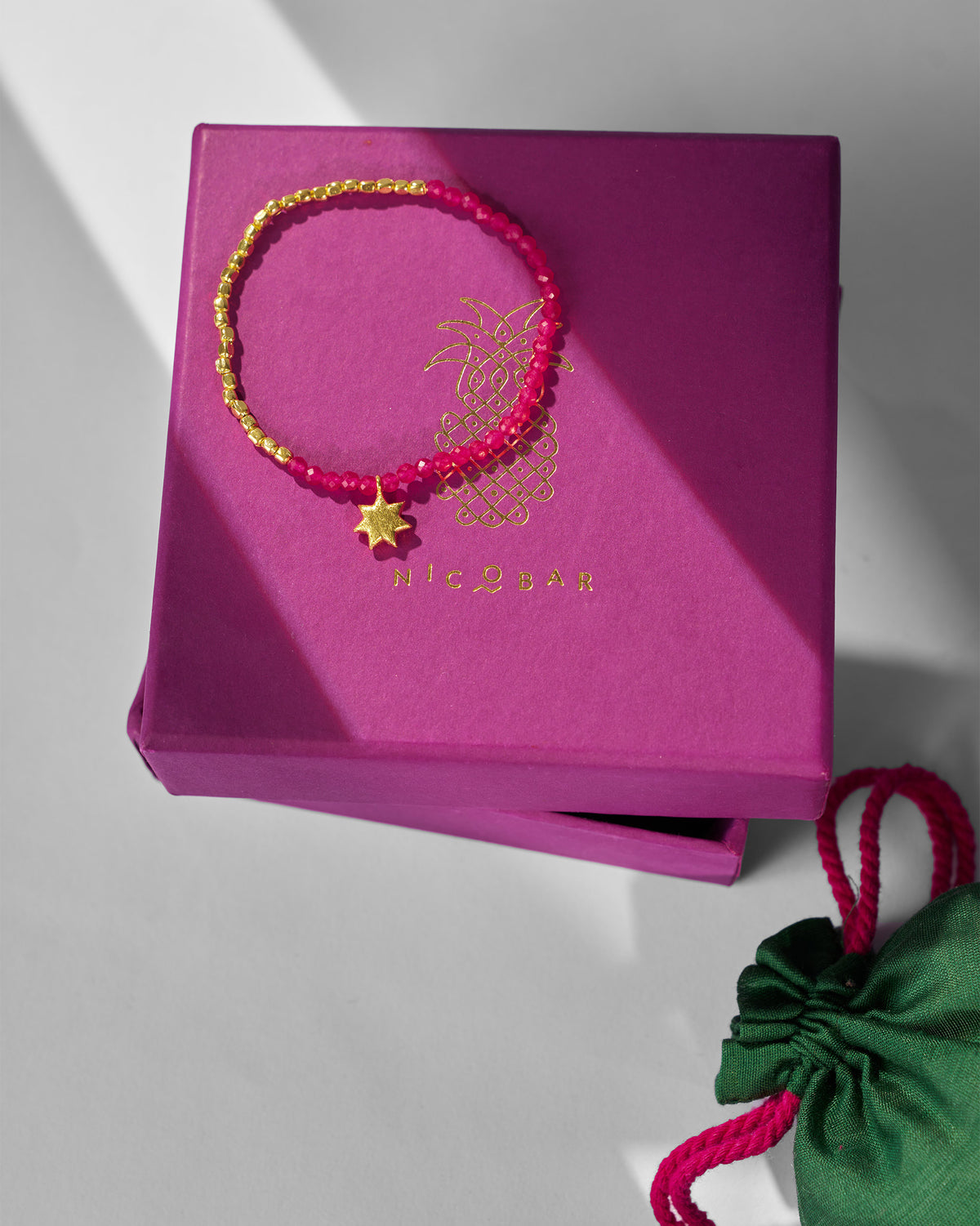 Sitara Bracelet displayed on a magenta Nicobar gift box.