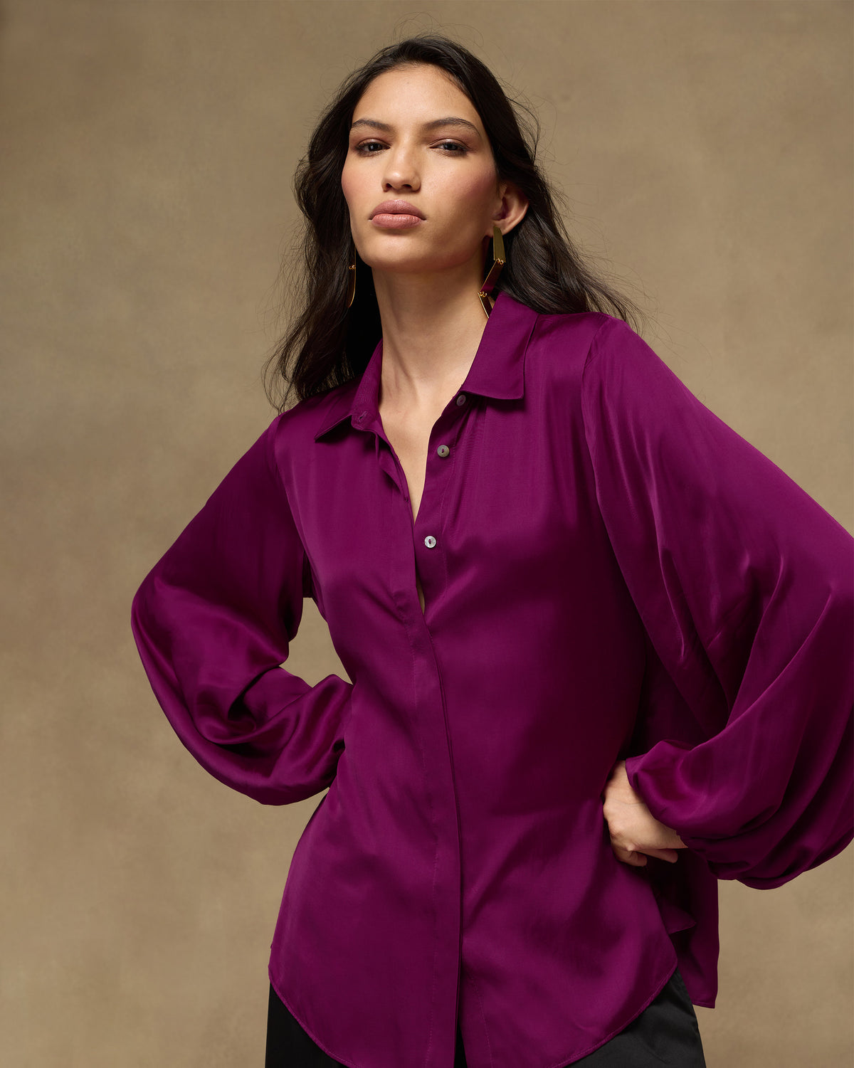 Person wearing a magenta satin Daydream Shirt with balloon sleeves.