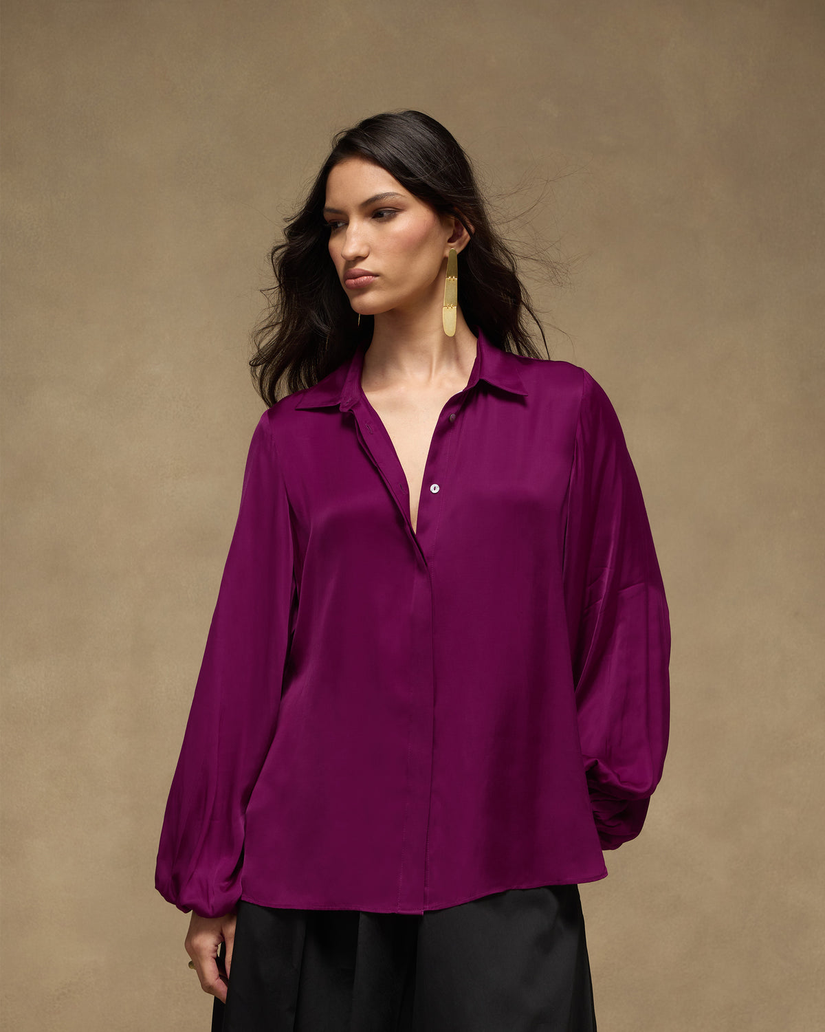 Person wearing a purple Daydream Shirt with a relaxed fit.