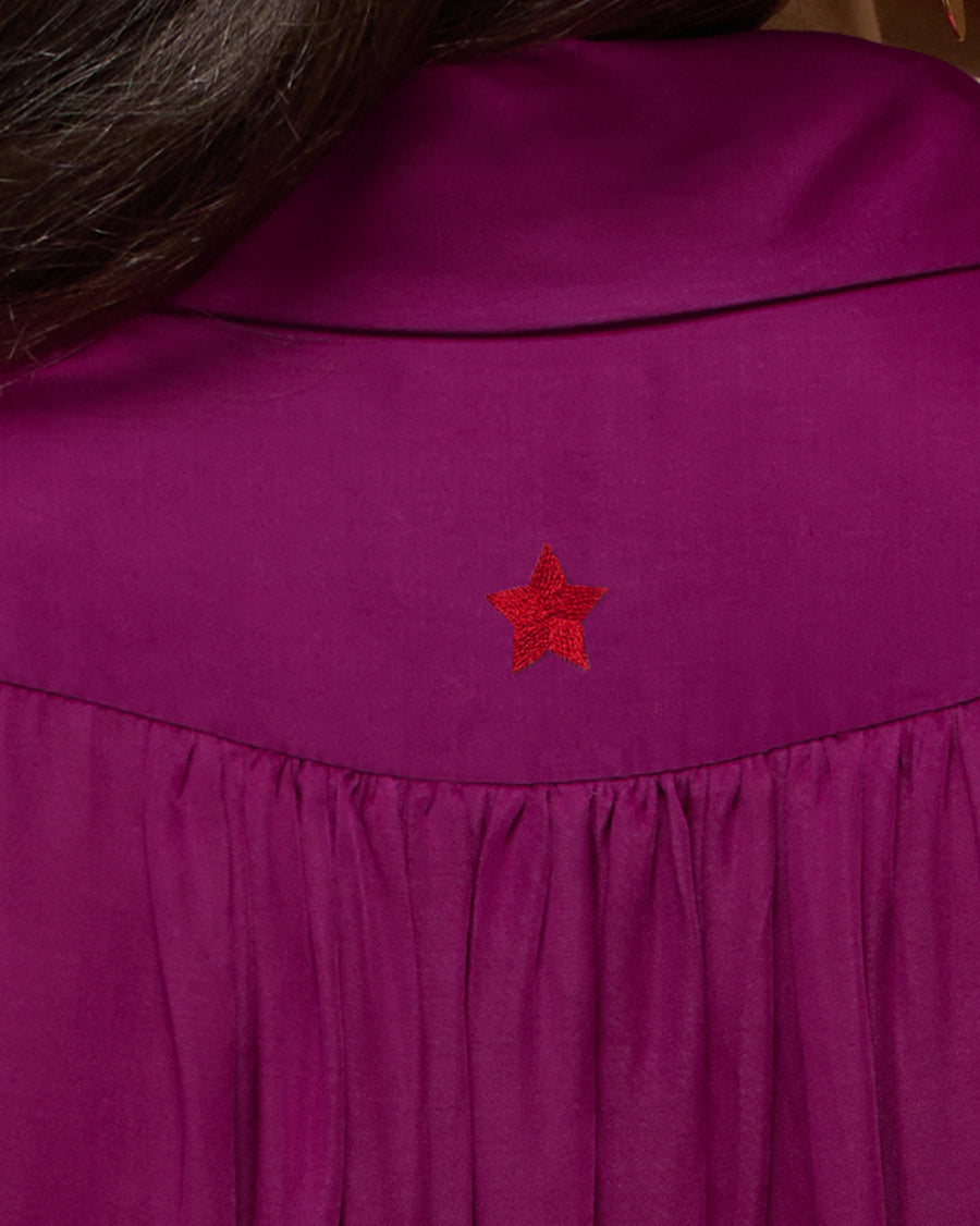 Close-up of the back yoke of the Daydream Shirt, with a small red star embroidered above the gathers.