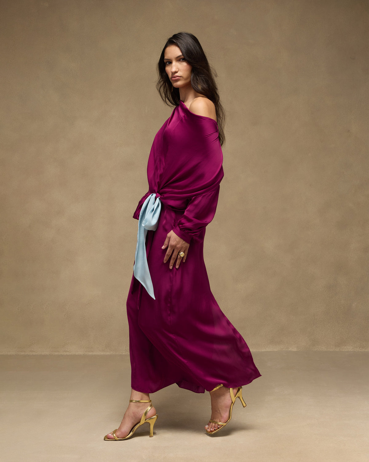 Side view of a mulberry satin Fireside Dress with a powder blue waist sash.