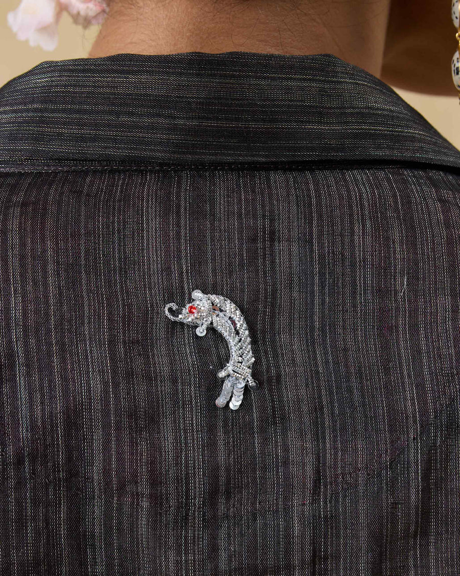 Close-up of the silver zardozi fish on the back of the Firefly Shirt.