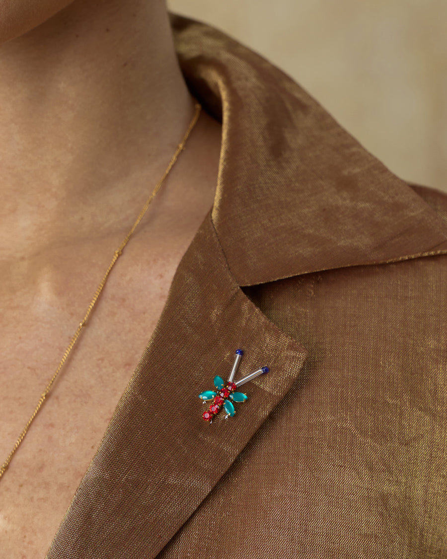 Close-up of the notch collar of the Golden Hour Shirt, with a small stone bug embroidered on it.