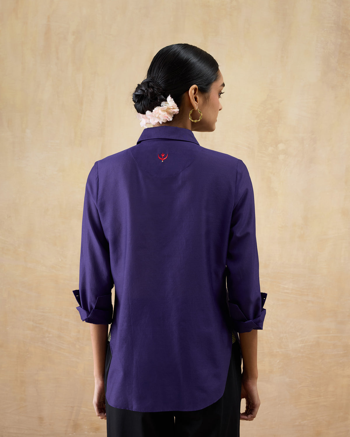 Back of a purple Tuxedo Shirt with a red tulip embroidery.