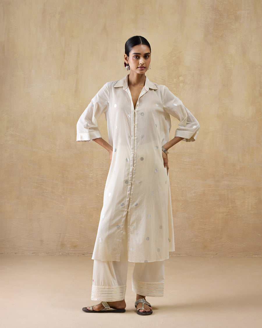The Rejoice Kurta, a long ivory cotton A-line kurta with a shirt collar and silver foil polka dots.