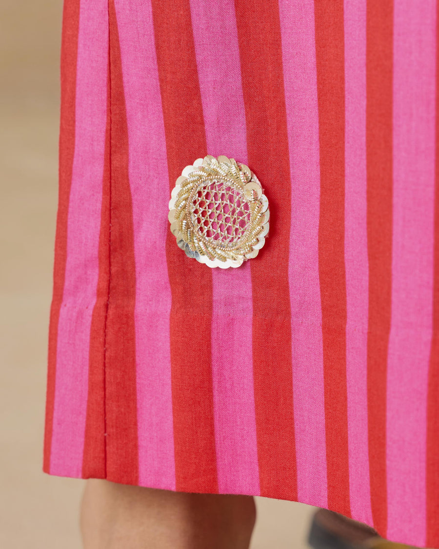 Close-up of the sequin zari flower patch at the hem of the Basic Pyjamas.