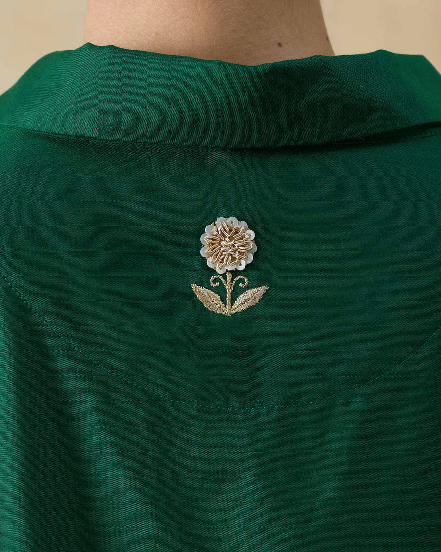Close-up of the zardozi flower in the moon patch at the centre back of the Hala Tunic.