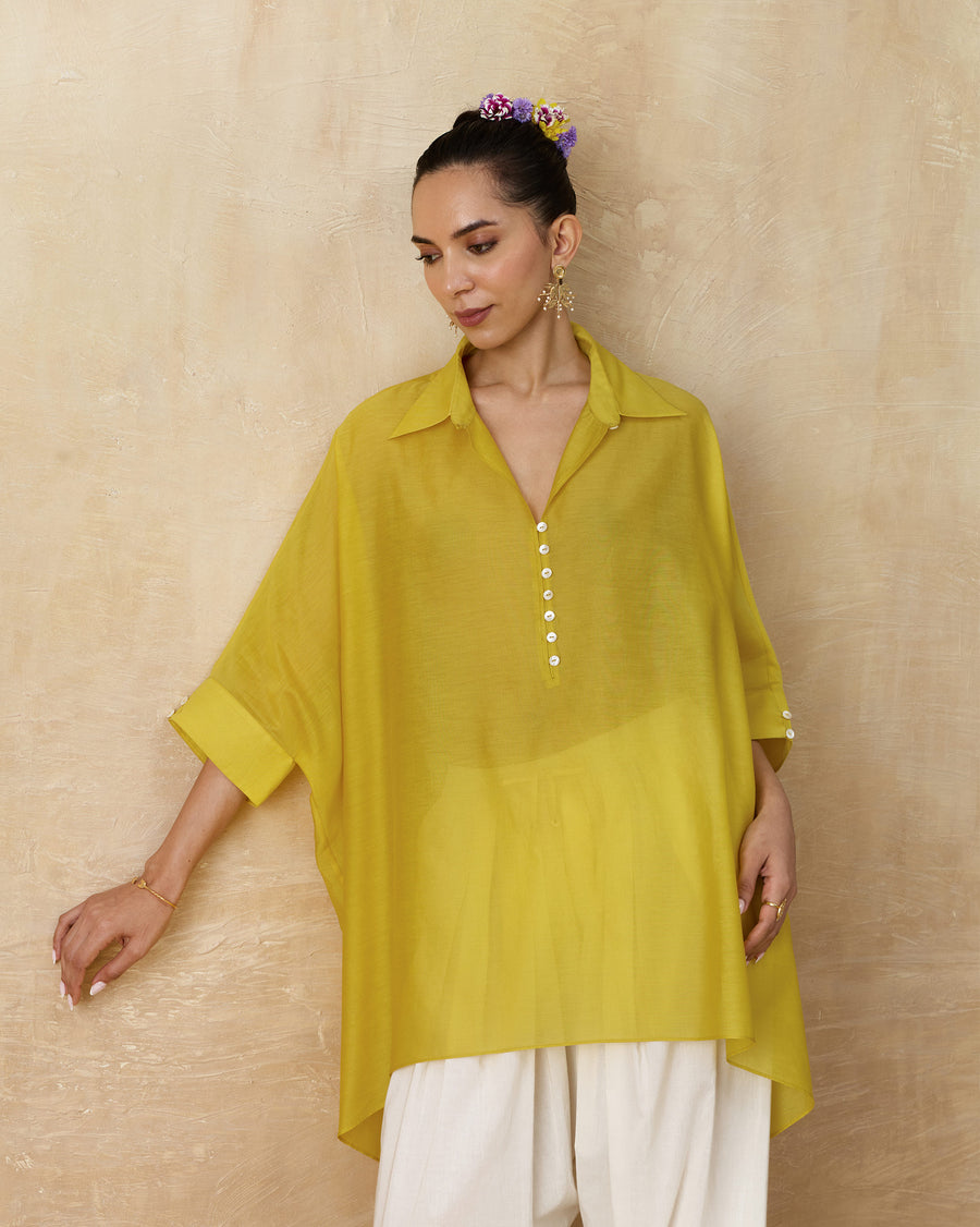 The Hala Tunic worn over ivory Numa Pants.