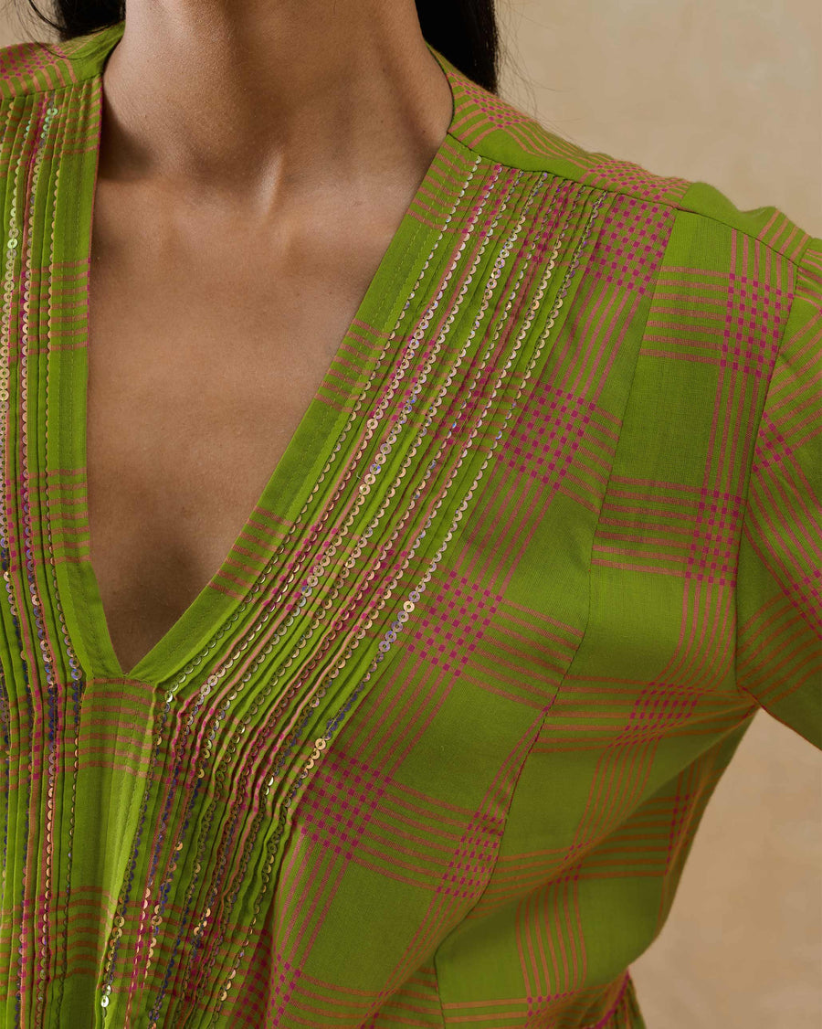 Close-up of the V-neck of the Pintuck Kurta, its pintucks picked out in silver sequins.