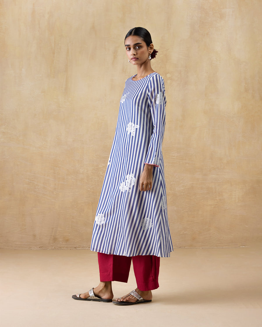 The Boat Neck Kurta seen from the side, mid-step.