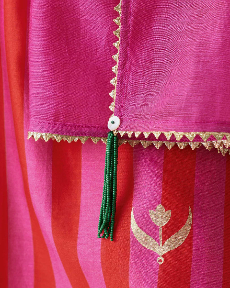 Close-up of a corner of the Bubbly Dupatta: triangle gota edging and a green bead tassel.