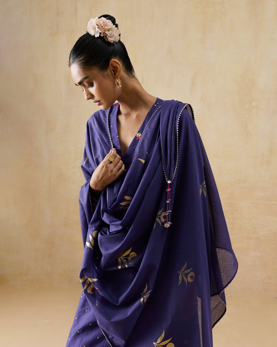 The Buzz Dupatta, a purple cotton silk dupatta with gold foil motifs, draped over both shoulders.