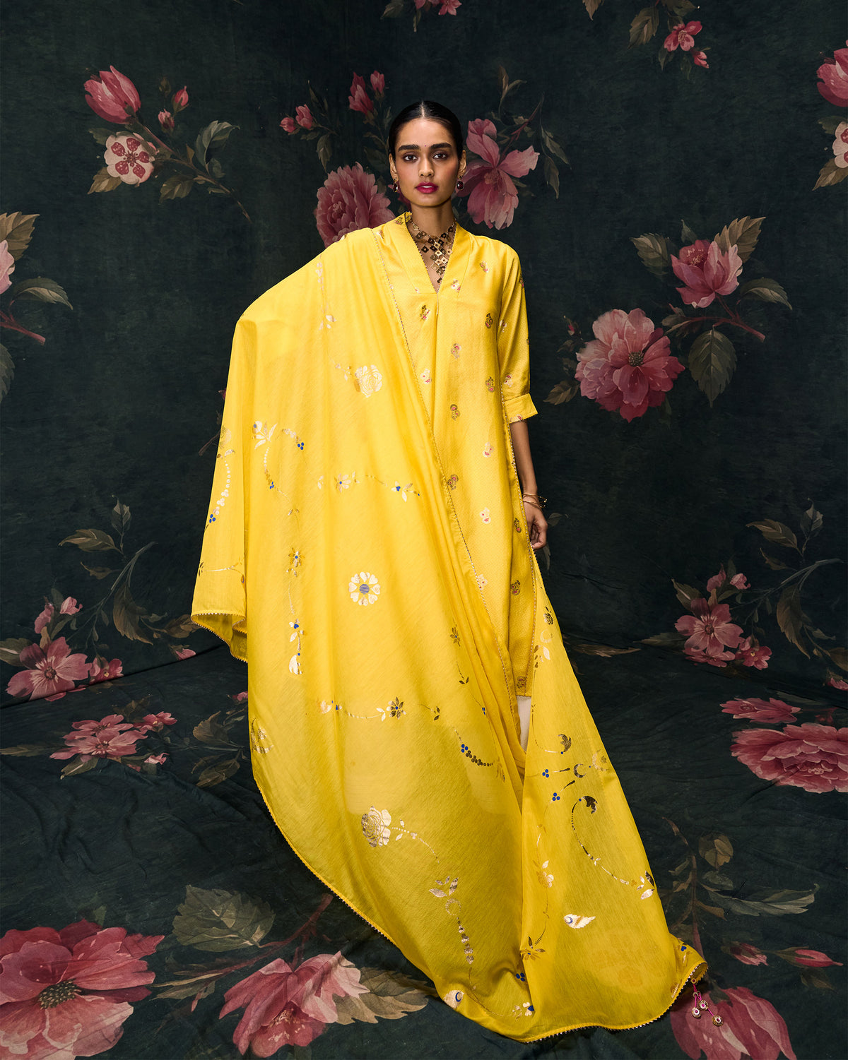 Person wearing a yellow Gale Dupatta draped down the front.