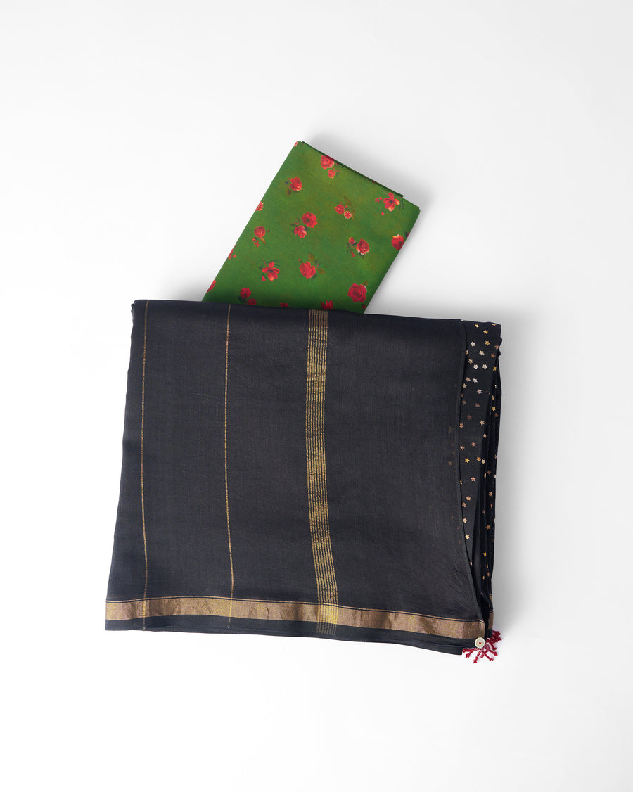 The Riverbank Sari folded flat with its blouse piece, showing the gold stripes at the border.