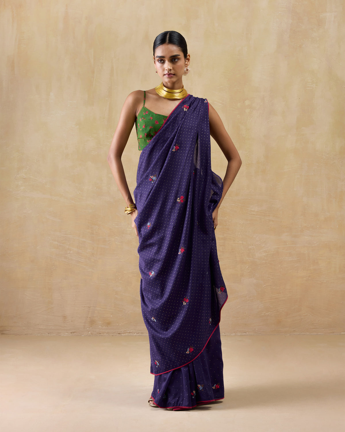 Person wearing a purple Midnight Dance Sari with a green printed blouse.