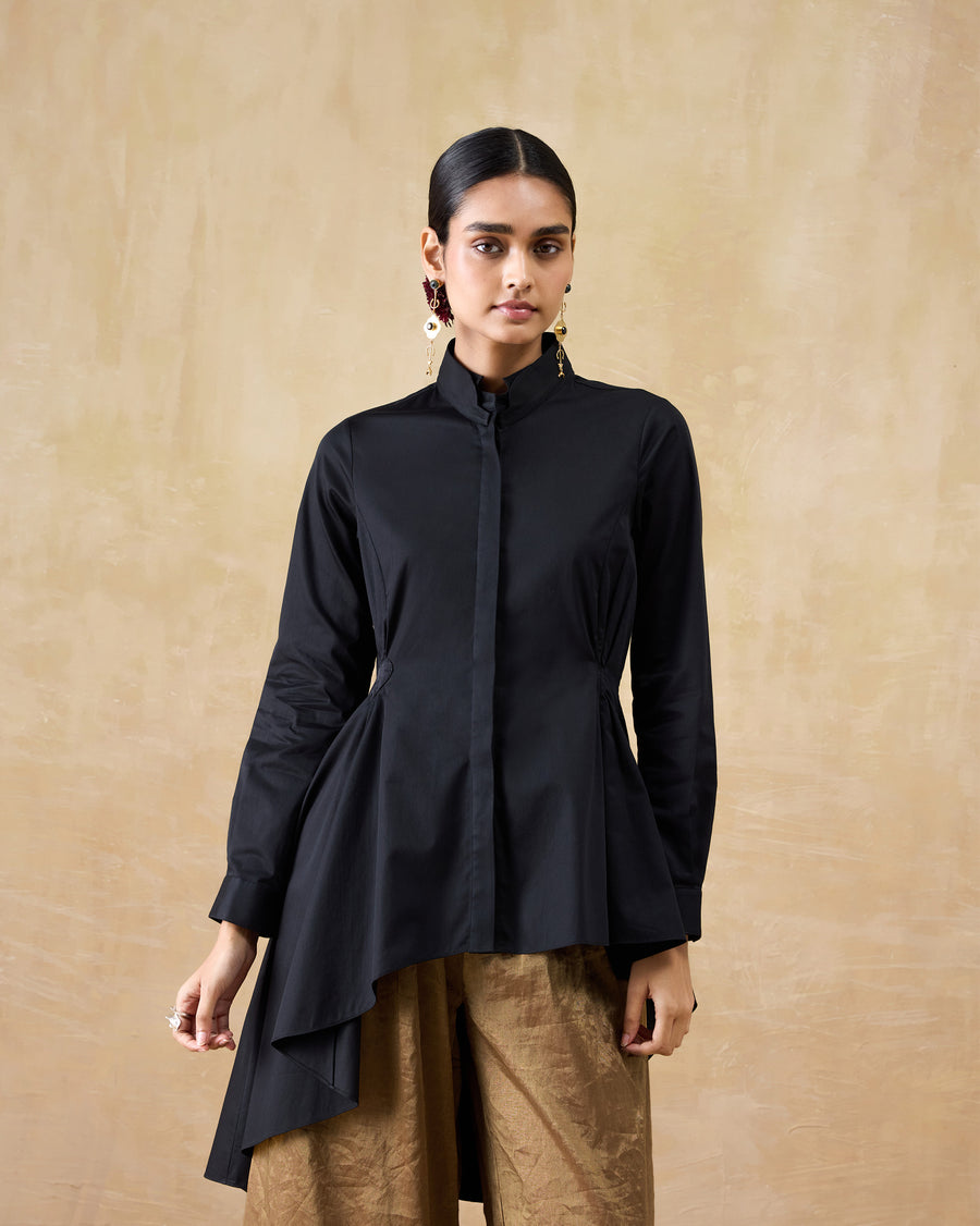 The Rai Top buttoned to the collar with the cuffs turned back.