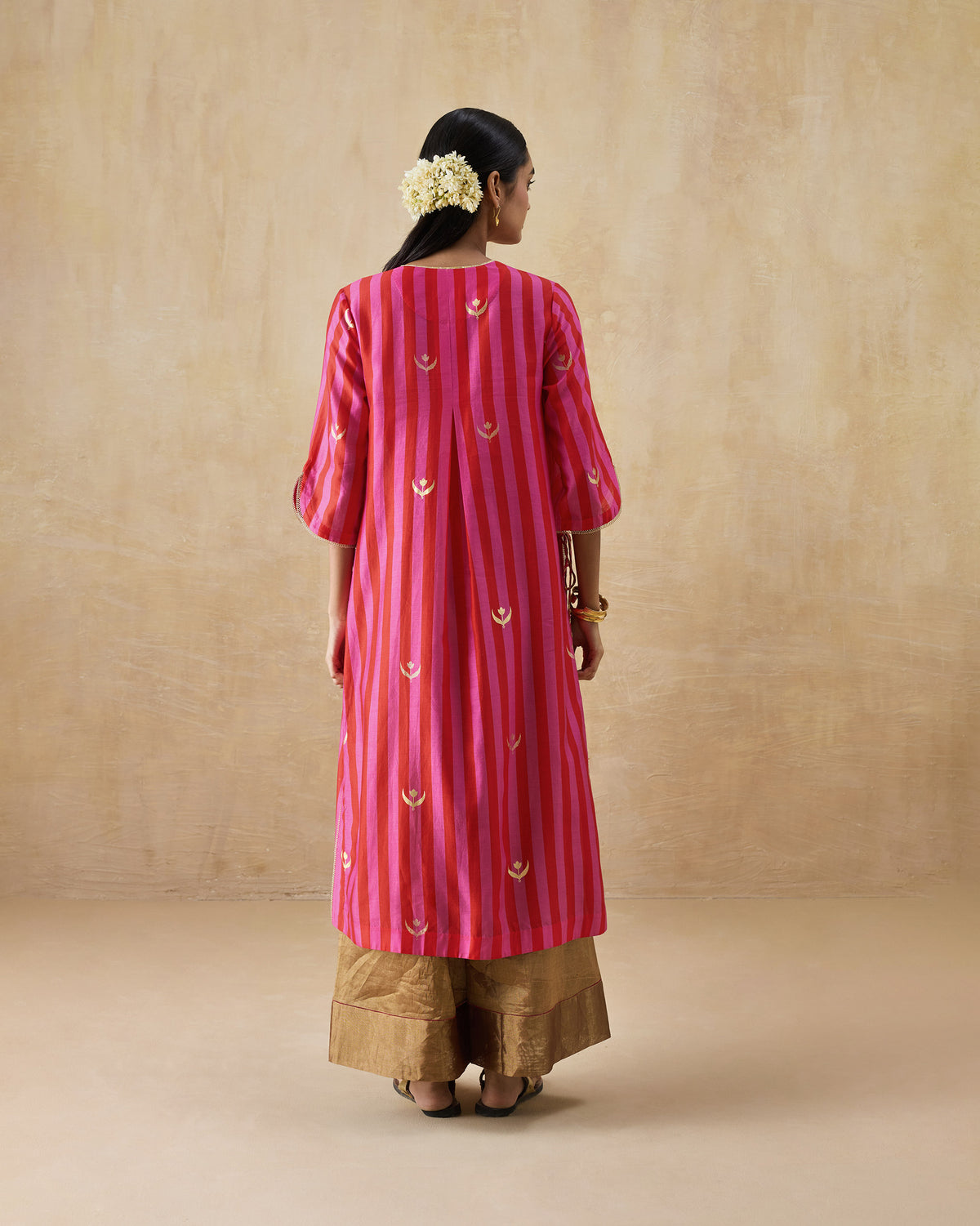 Back of a red and berry striped Galaxy kurta with a centre back pleat.