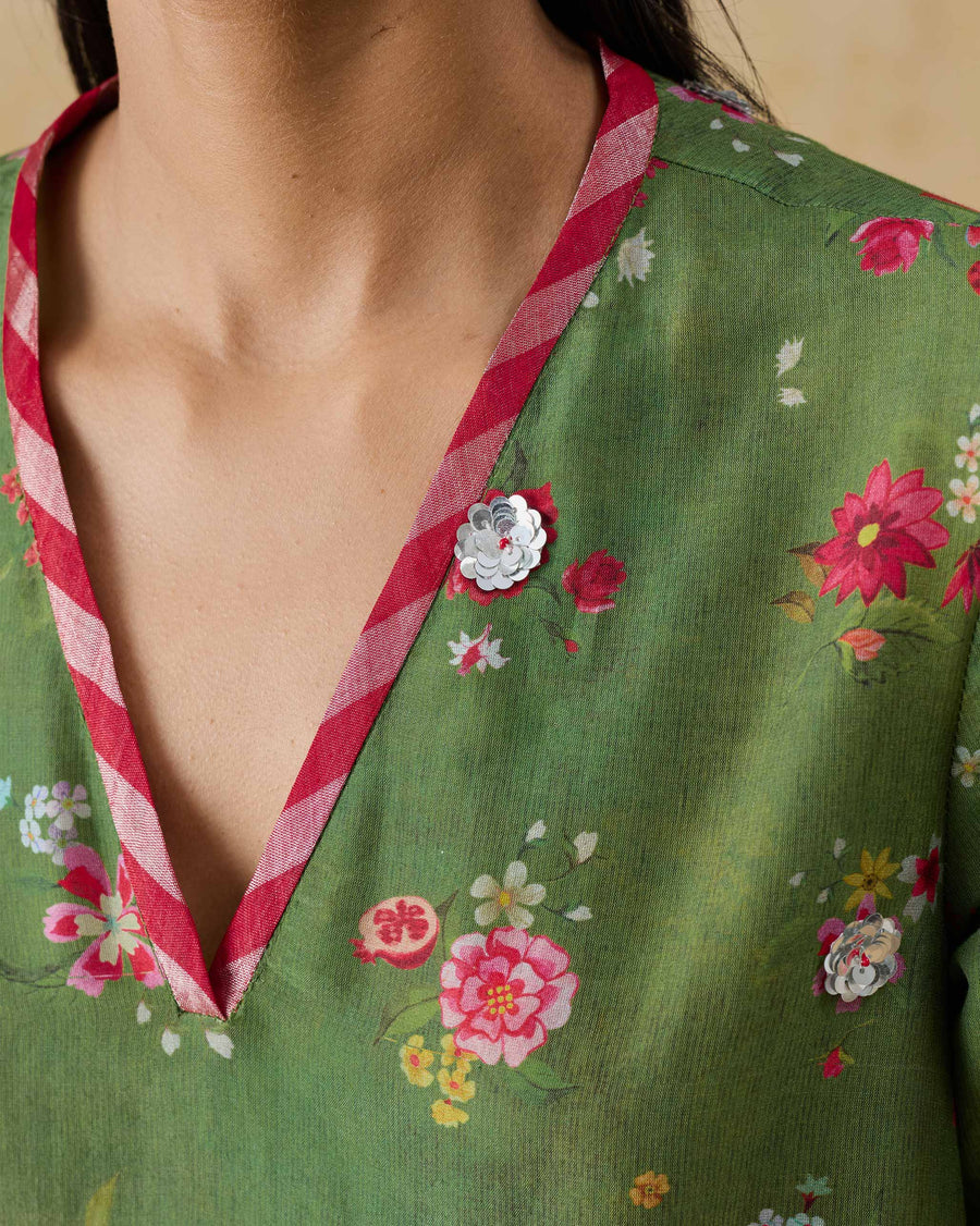 Close-up of the V-neckline of the Cascade Kurta, bound in red and silver Kandy stripe.