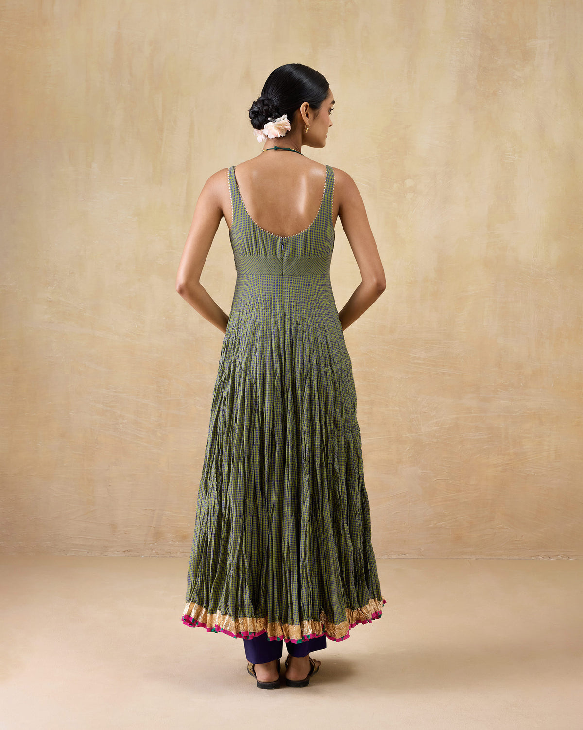 Back of a purple-and-lime check Kochi kurta with a deep scoop and gold hem.