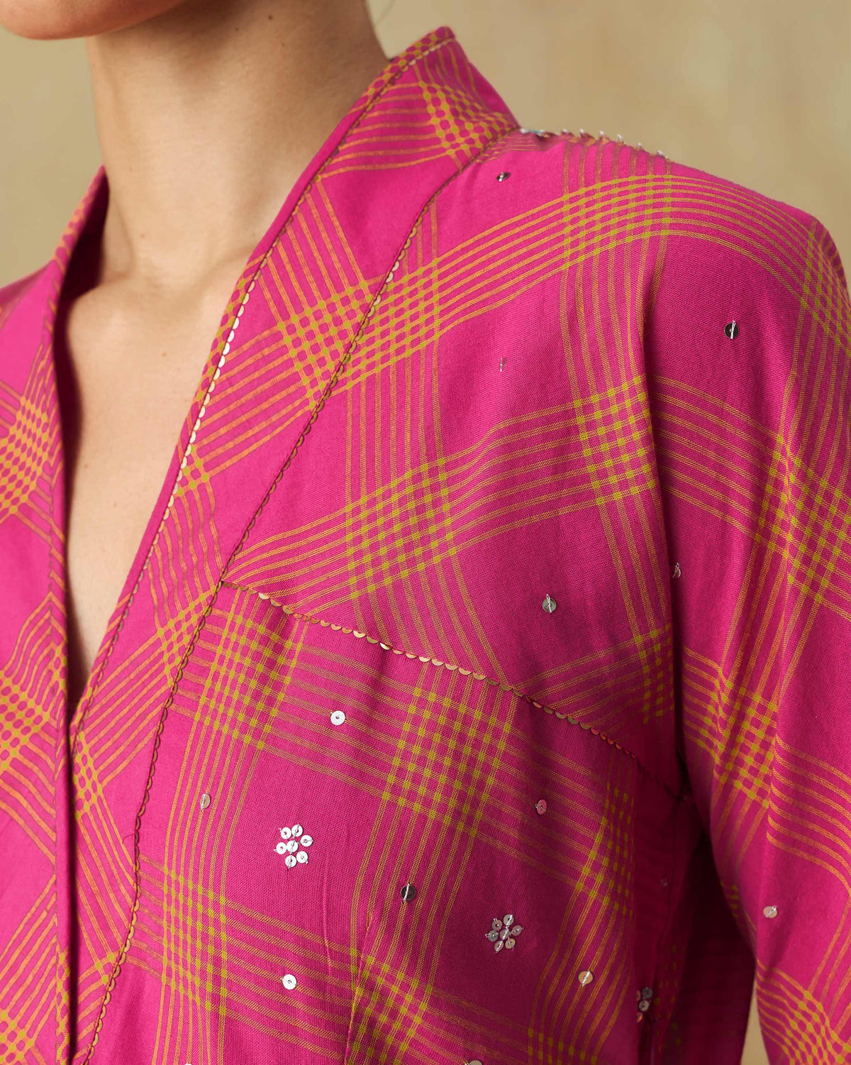 Close-up of sequin embroidery on the berry and lime check Drifter kurta.