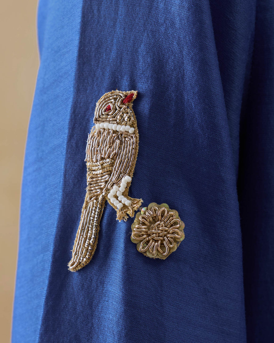 Close-up of the zardozi bird and flower on the sleeve of the Moonsong Kurta.