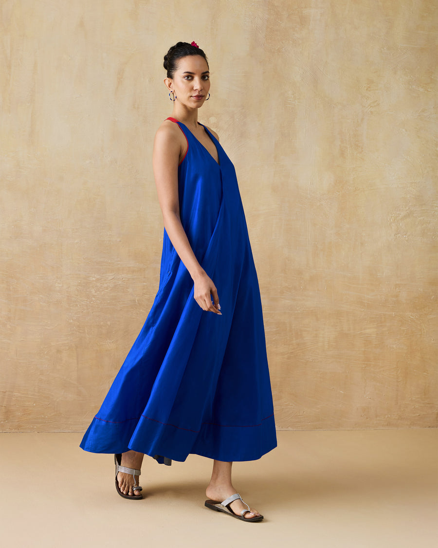 The Akira Twist Back Dress seen from the side with flat sandals.
