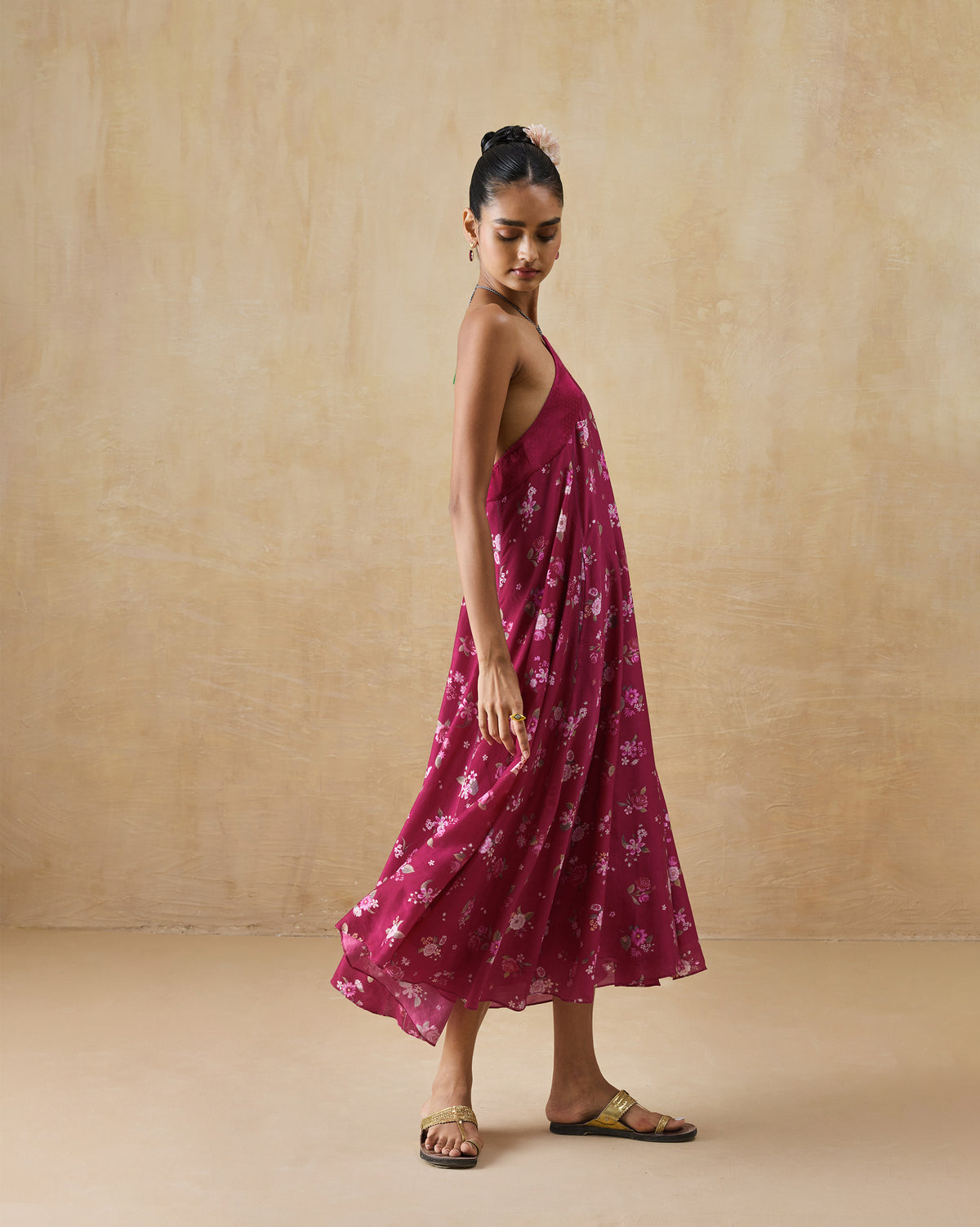 Side view of a berry floral Lumen dress with an A-line silhouette.