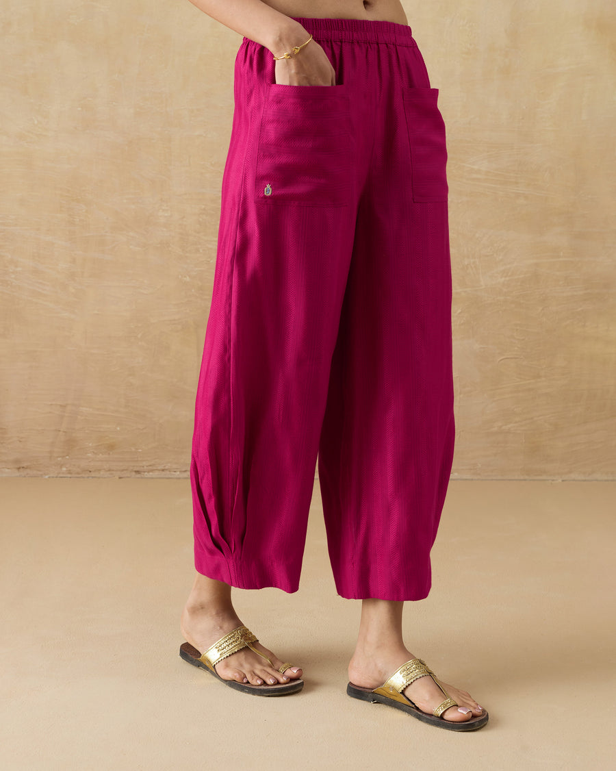 Side view of the Serene Pants, one hand in the front pocket.