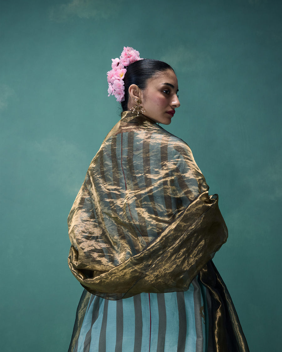 The Marpeta Dupatta, a sheer gold metallic tissue dupatta, wrapped around the shoulders over the Midnight Club Kurta.