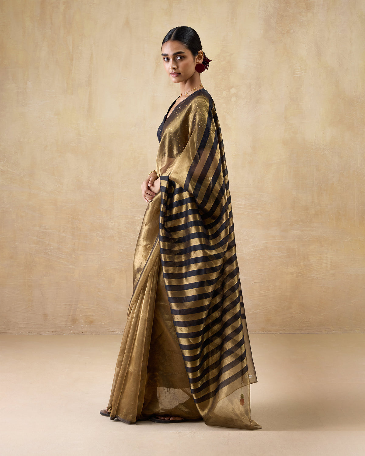 Gold metallic Dancefloor Sari showing bold black stripes on the pallu.