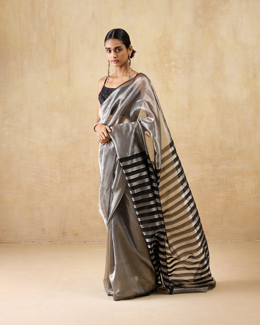 The Party Stripes Sari seen at an angle, the striped pallu falling to the hem.