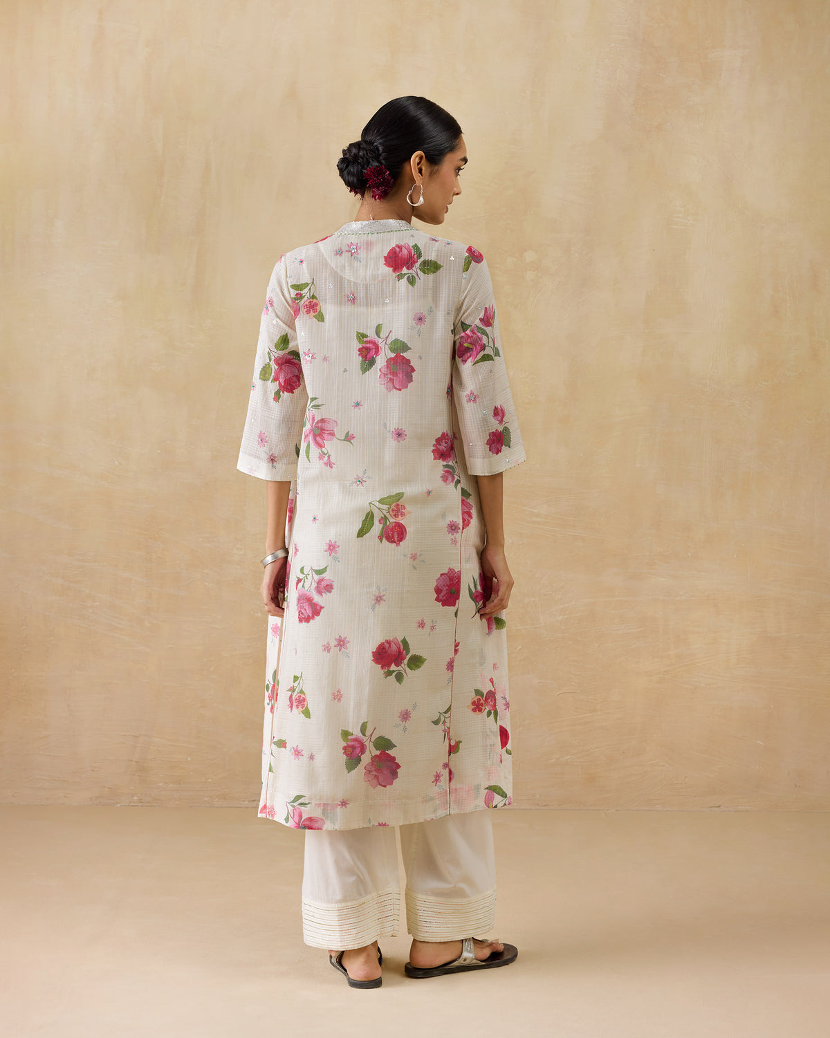 Back of an ivory kurta with a pink rose print.