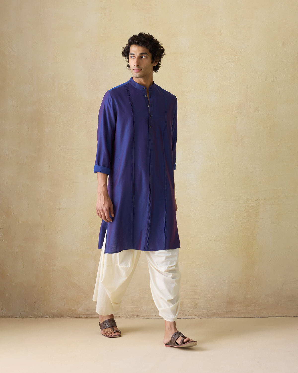 Person wearing a dual-tone purple Naaz kurta with front panel seams.