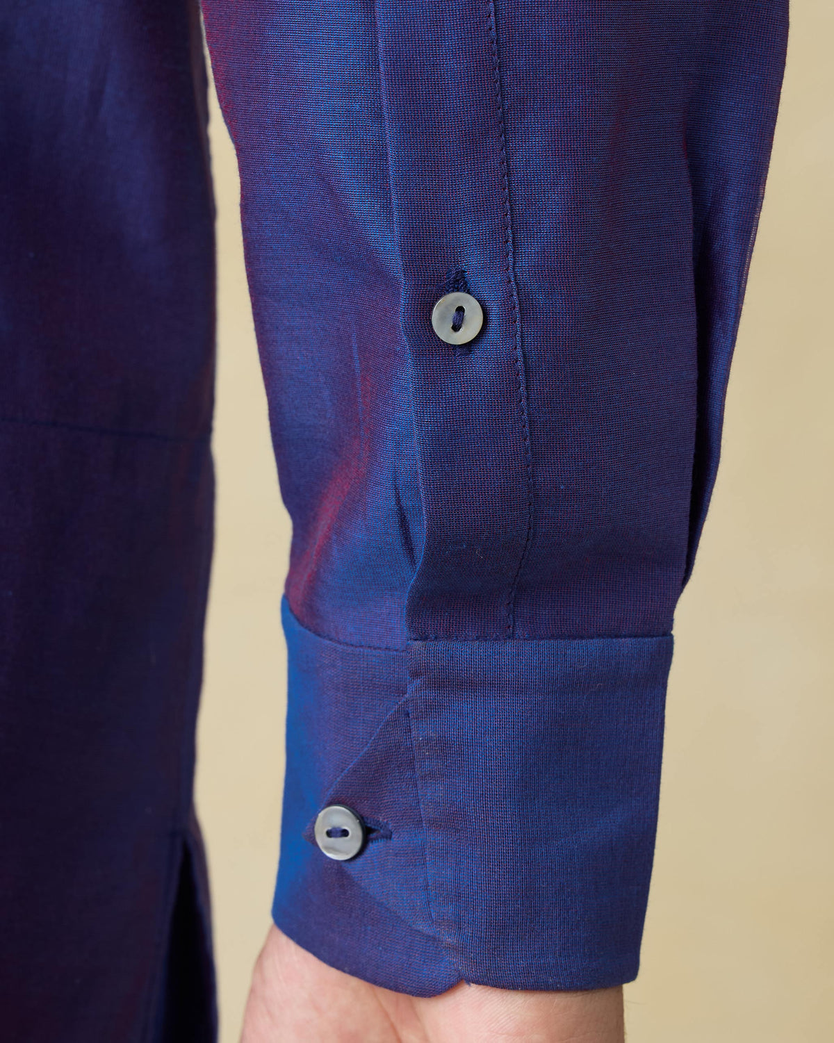 Close-up of the sleeve cuff on a dual-tone purple Naaz kurta.
