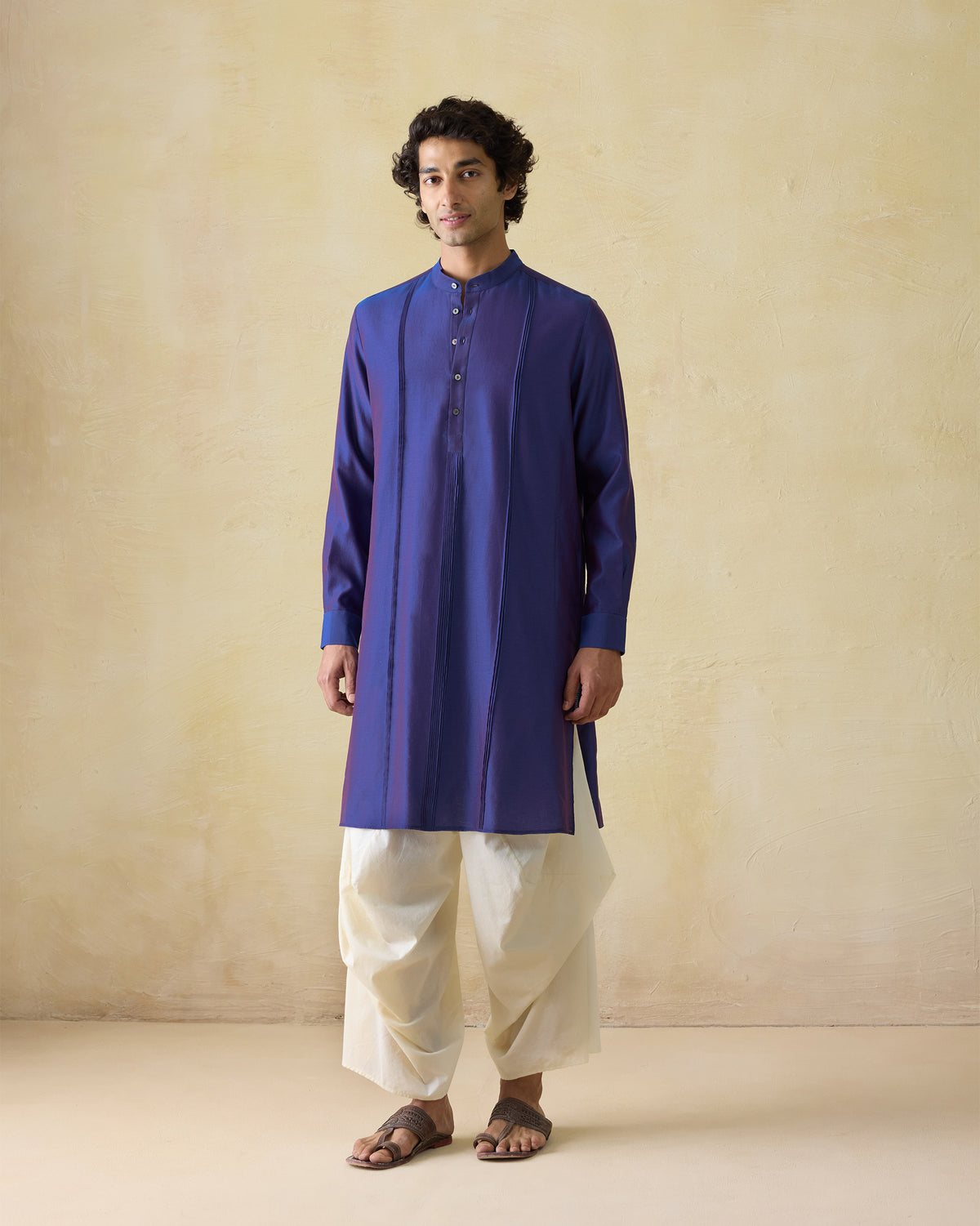 Person wearing a dual-tone purple Naaz kurta with front panel seams.