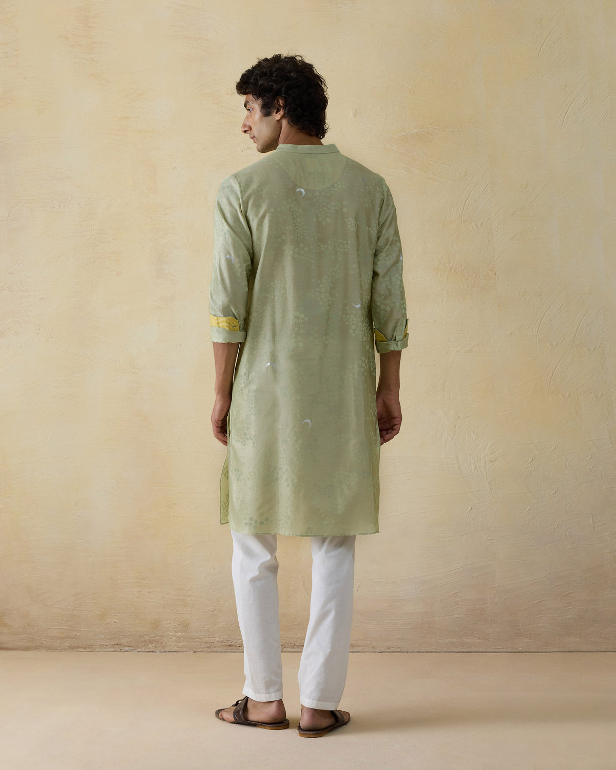 Back of a mint green Bageecha kurta with moonfoil print.