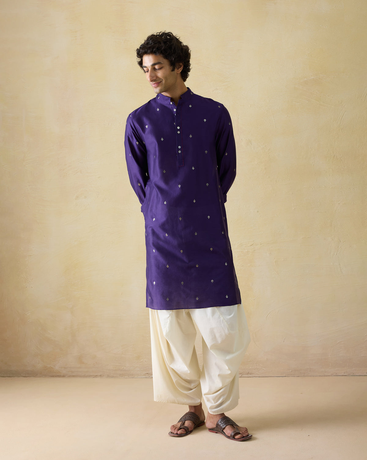 Dark purple Rey kurta with silver embroidery worn full length.
