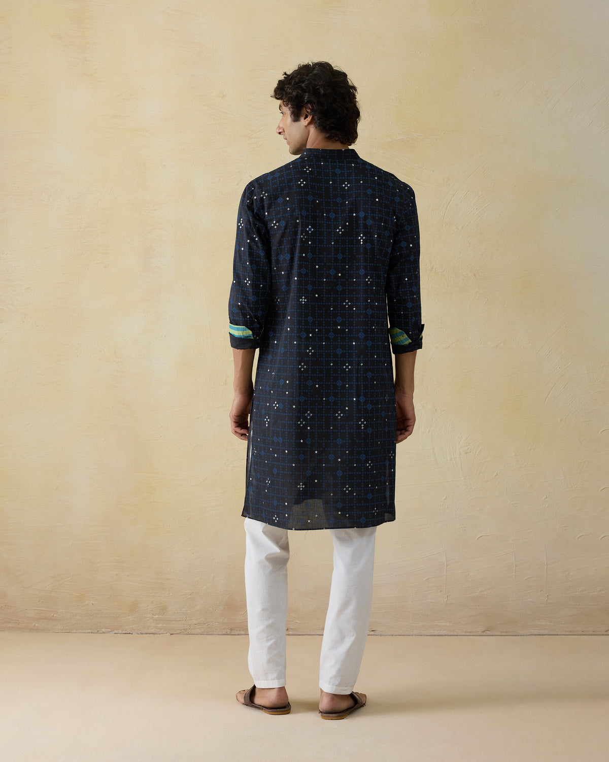 Back of a dark navy Neckband Kurta with a geometric foil print.