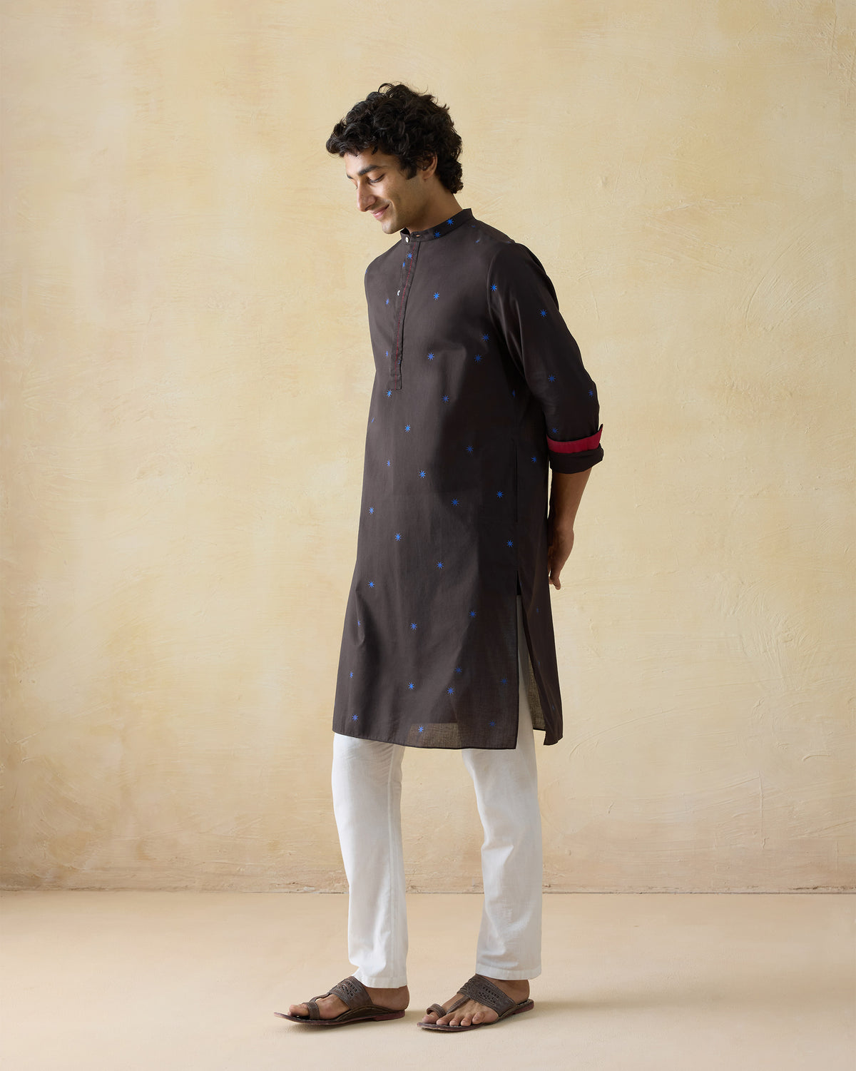 Side view of a brown Gala Kurta with blue star dots.