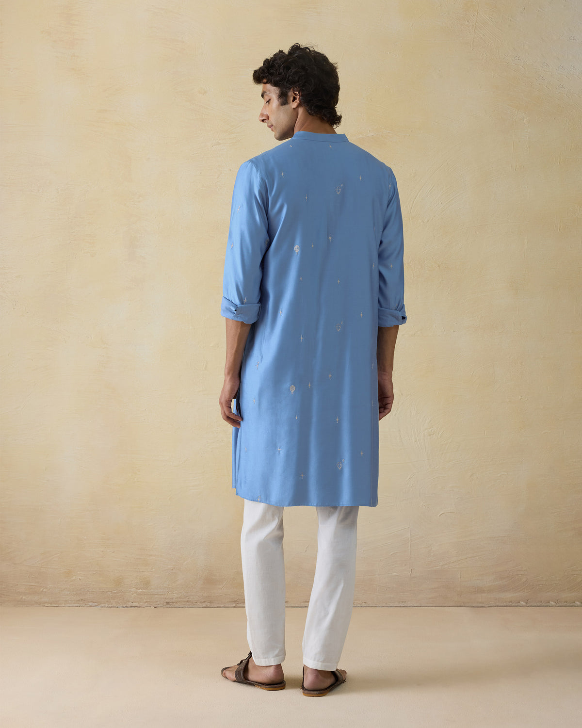 Back of a light blue Bageecha kurta with silver balloon embroidery.