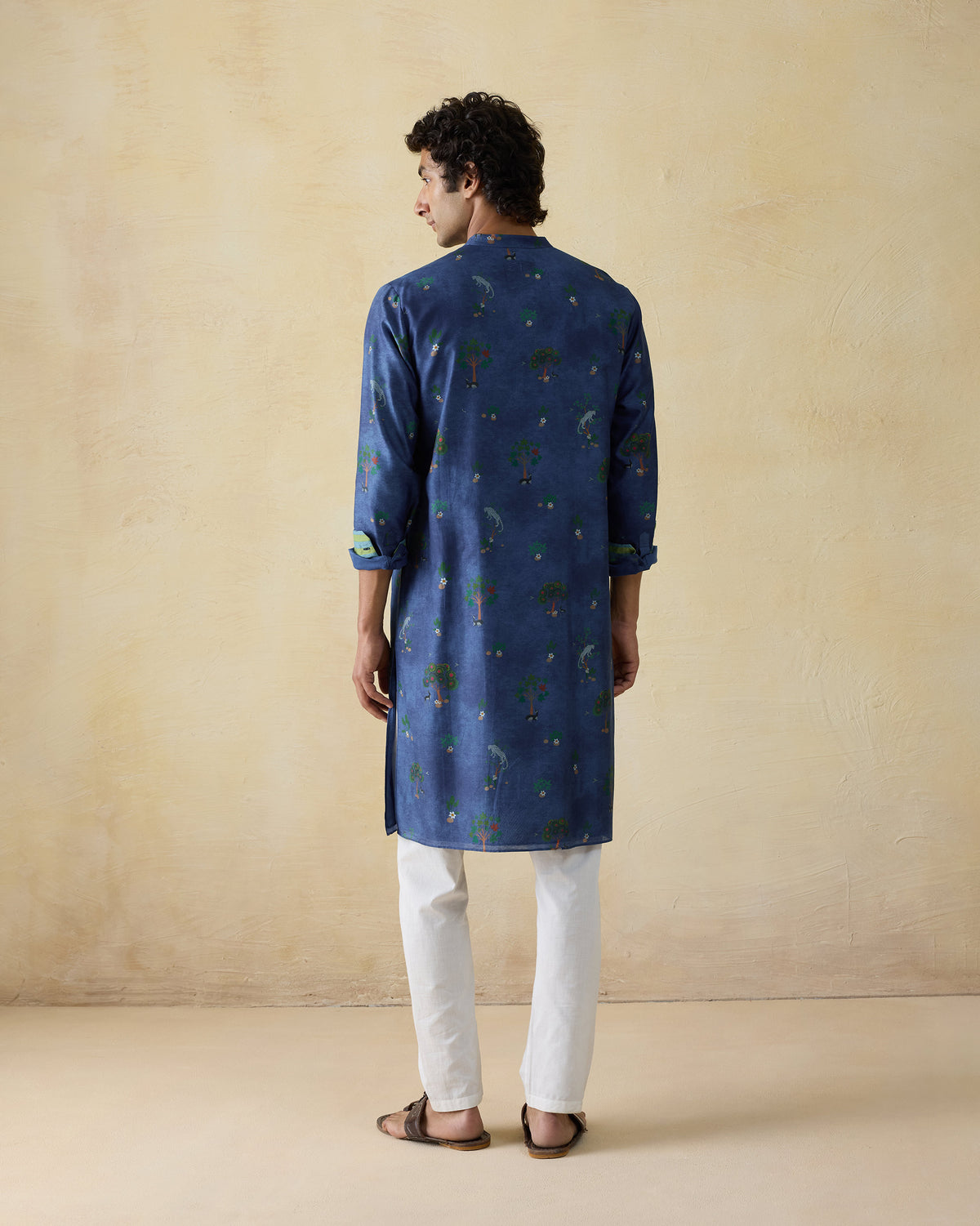 Back of a teal blue Astral kurta with a valley print.