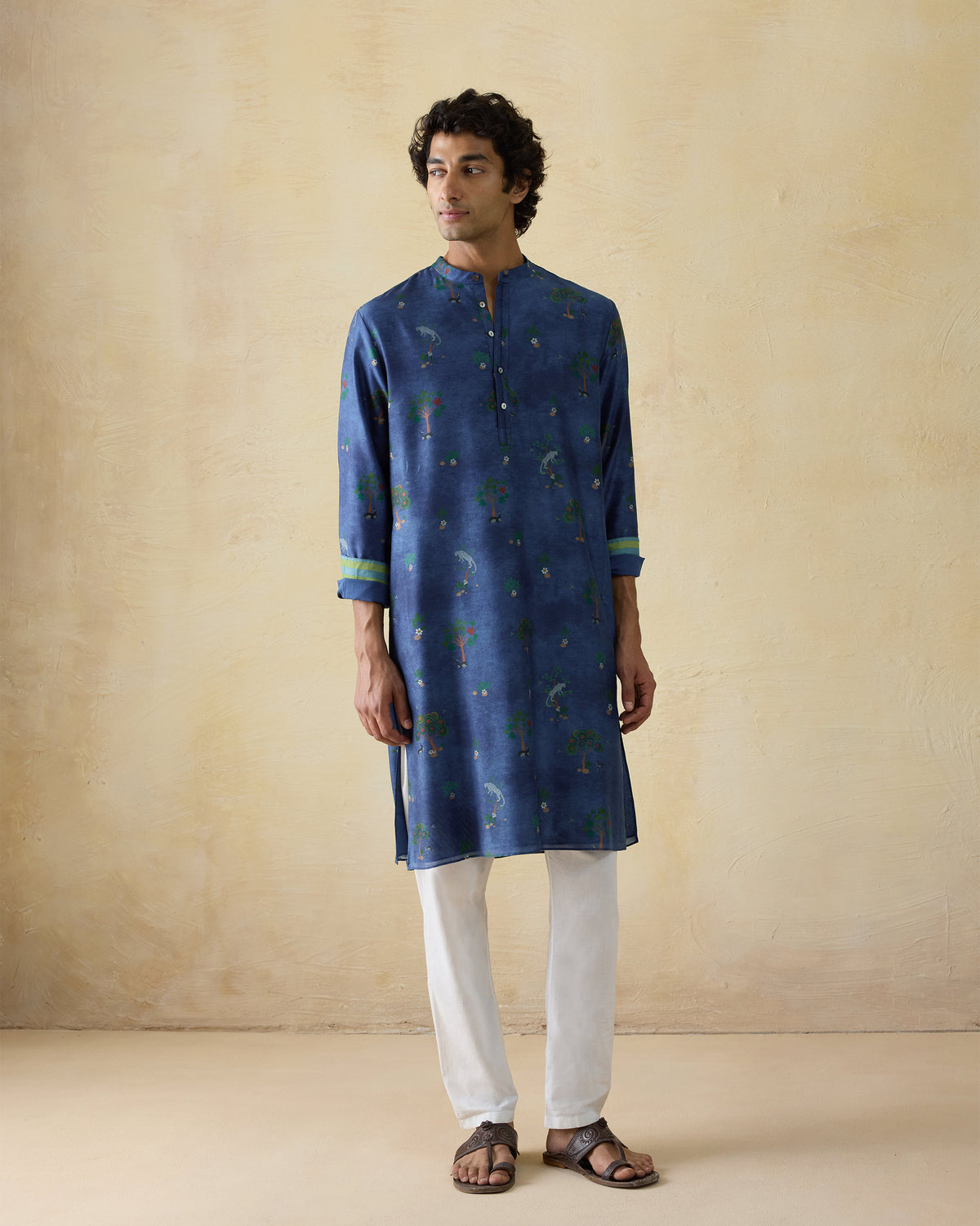 Person wearing a teal blue Astral kurta with a valley print.