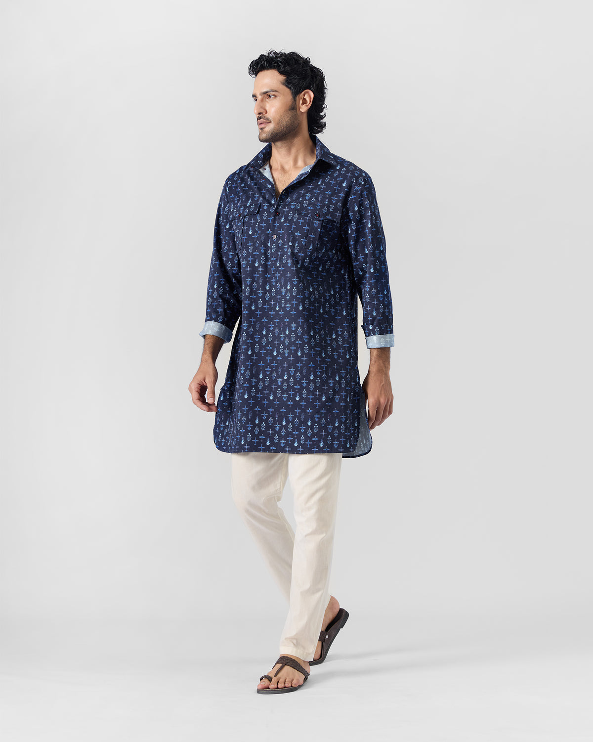 Person walking in a dark blue Hawai Sa Kurta.