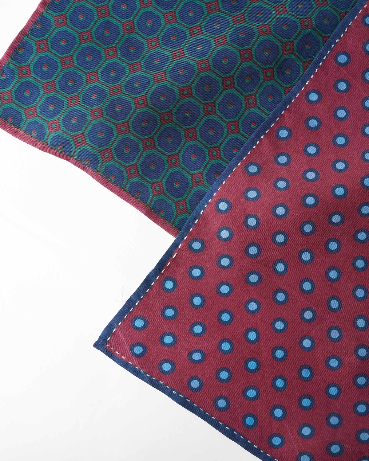 Close-up of Pipit silk pocket squares showing contrast hand-rolled hems.