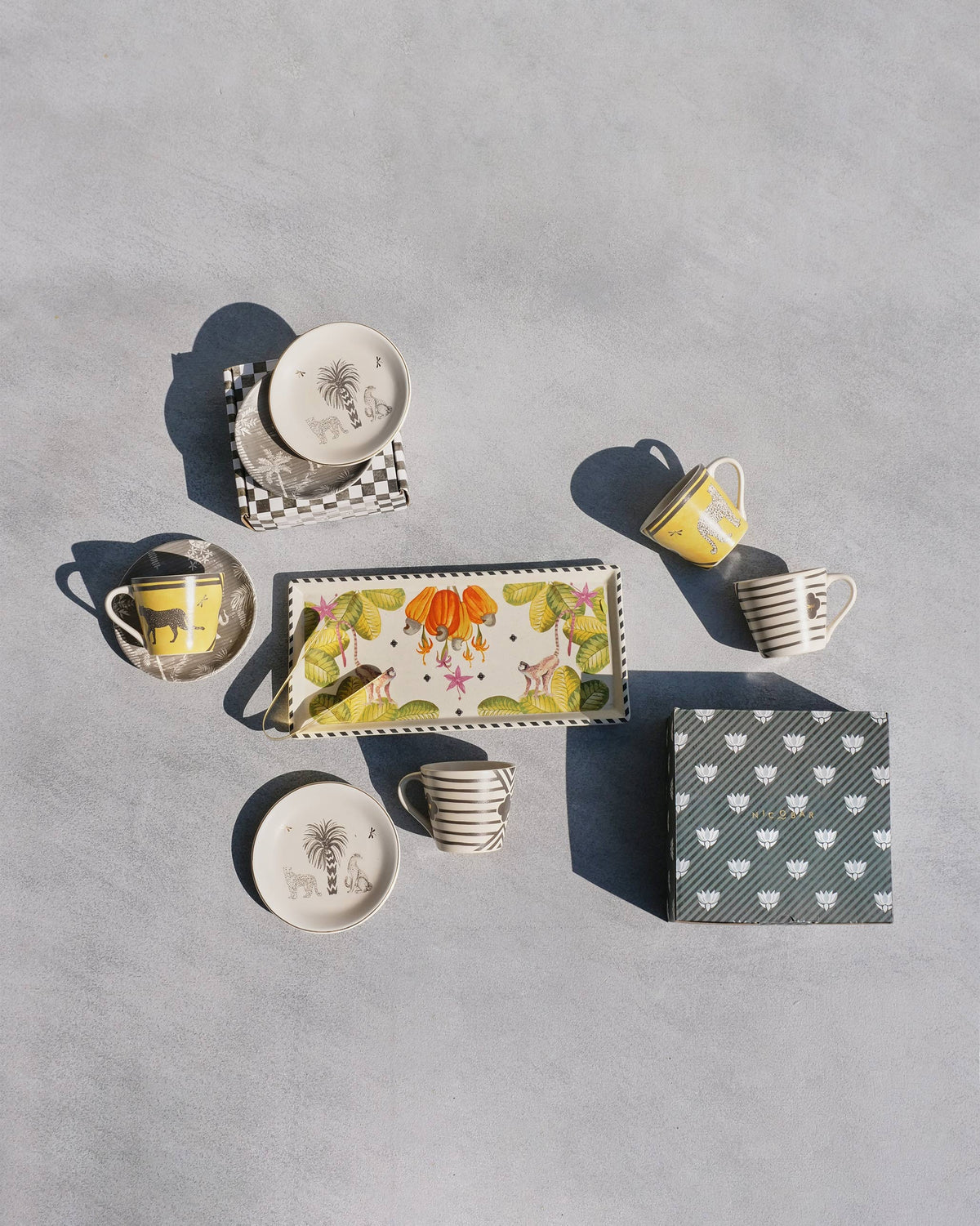 Serenity Set with cashew cookie tray, espresso mugs, tea plates and gift boxes.