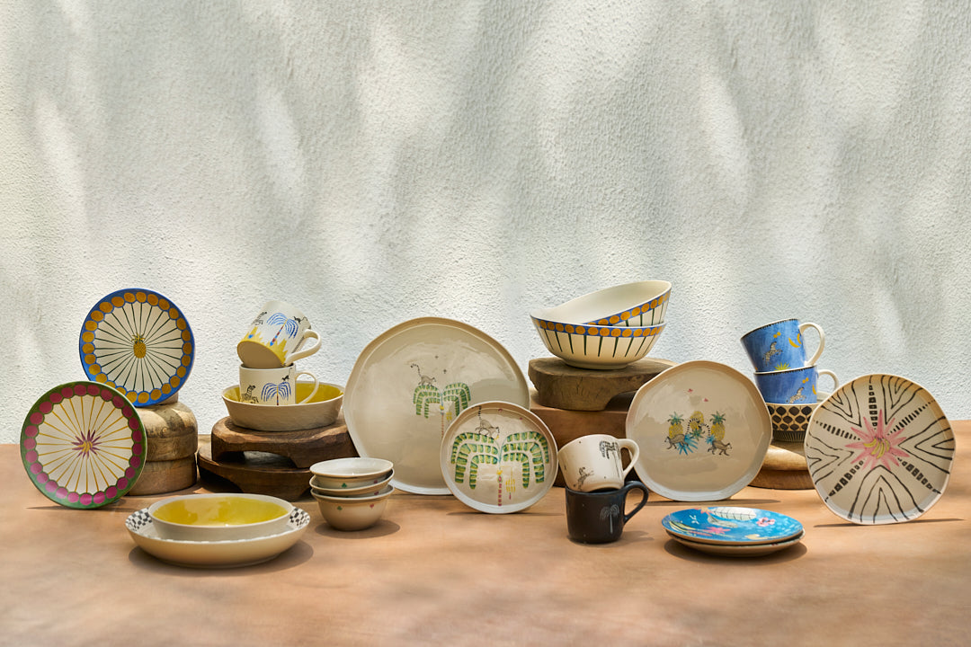 Teal Mahi quarter plate among a tropical ceramic tableware collection.