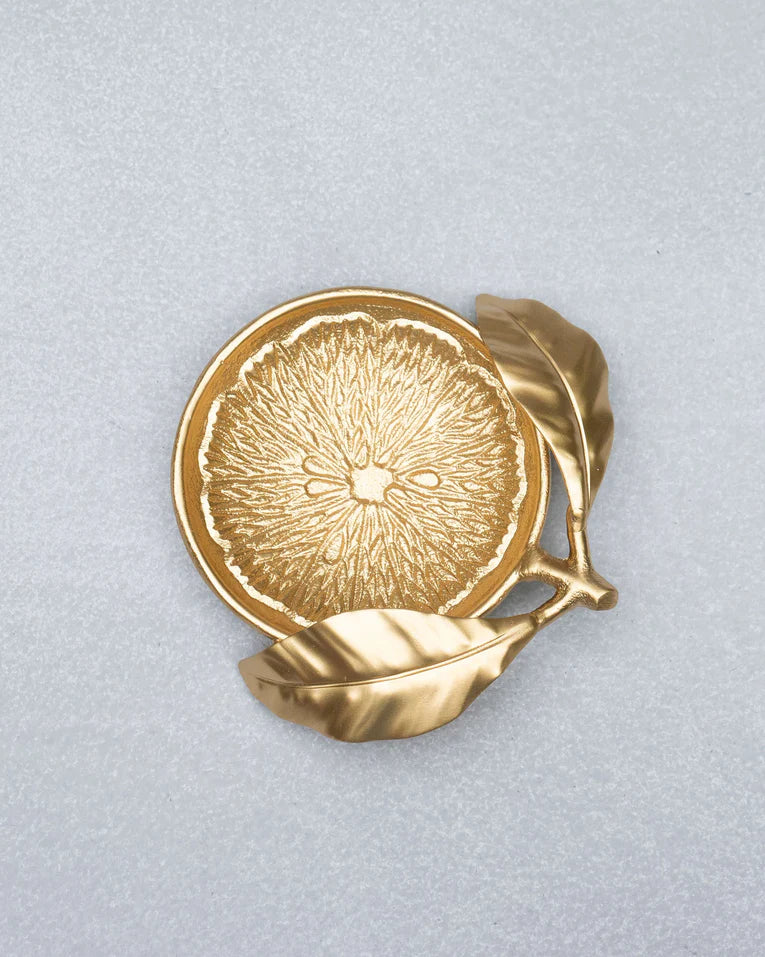 Gold Lemon Trinket Tray with a citrus-segment interior and leaf stem.