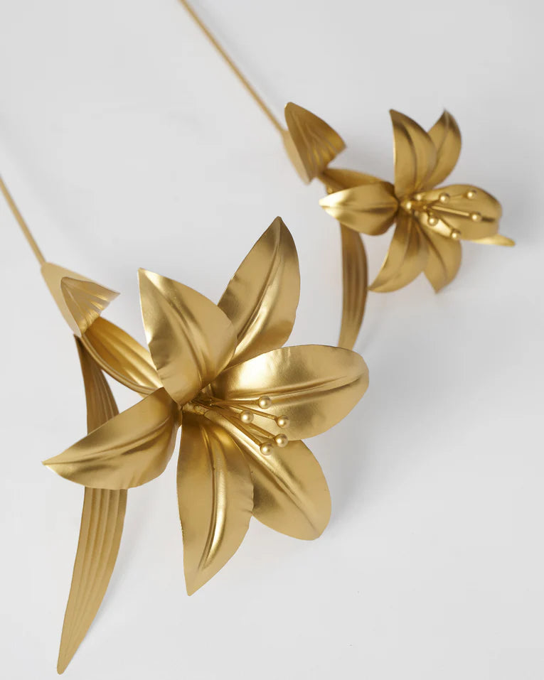 Close-up of gold Lily Accent Pieces showing petals and stamens.