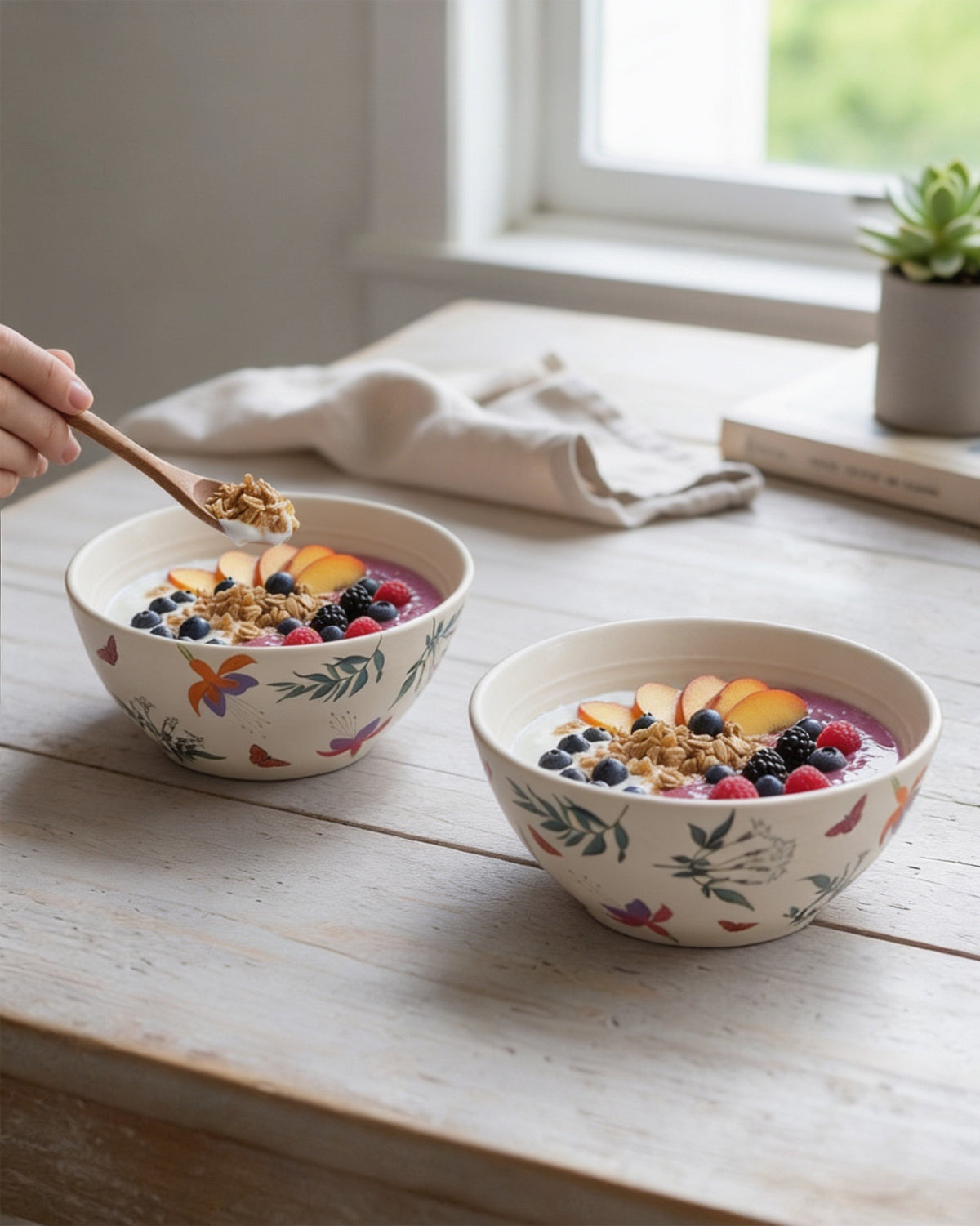 Botanical bowls with granola and fruit.
